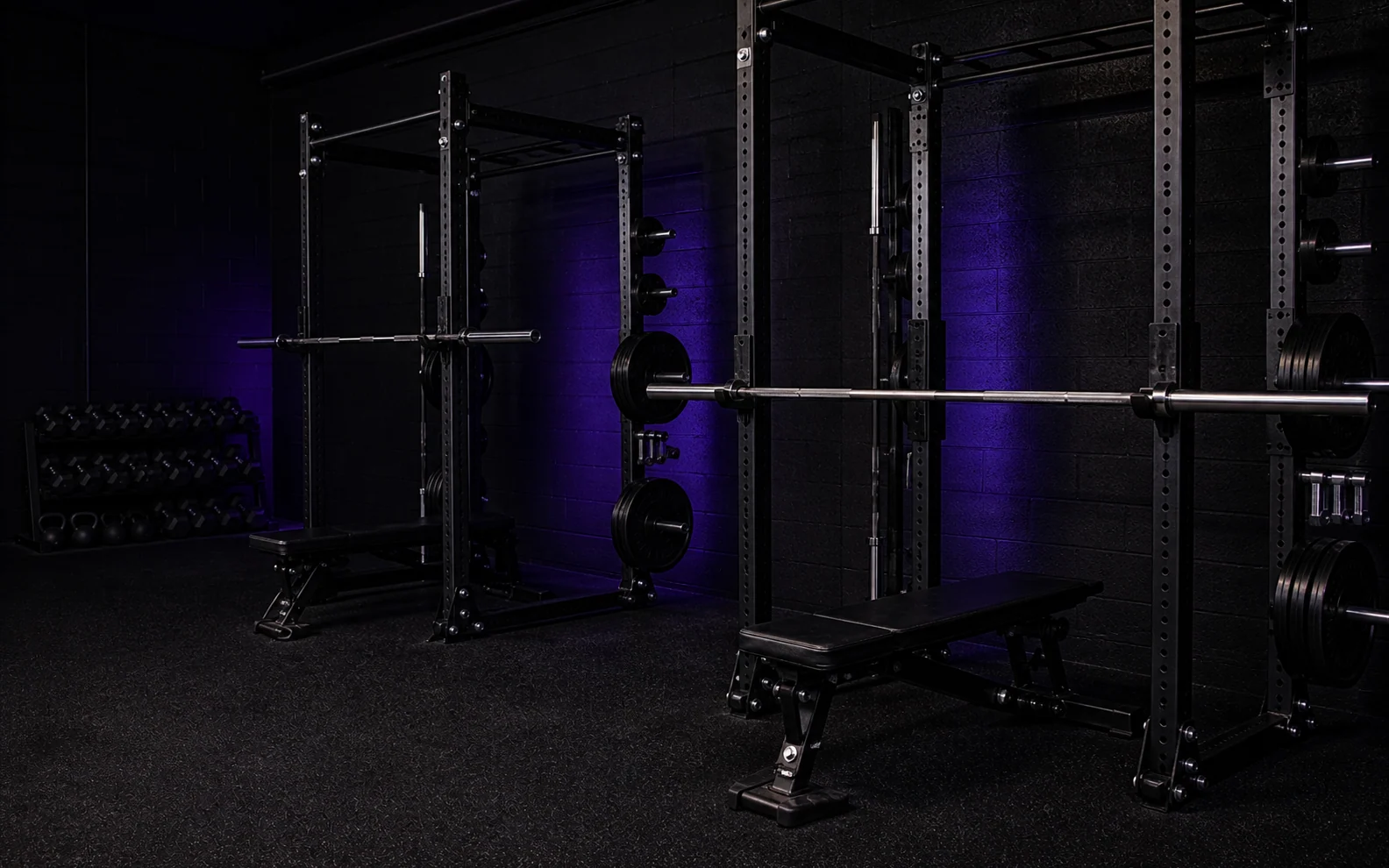 A quiet strength studio with racks and free weights